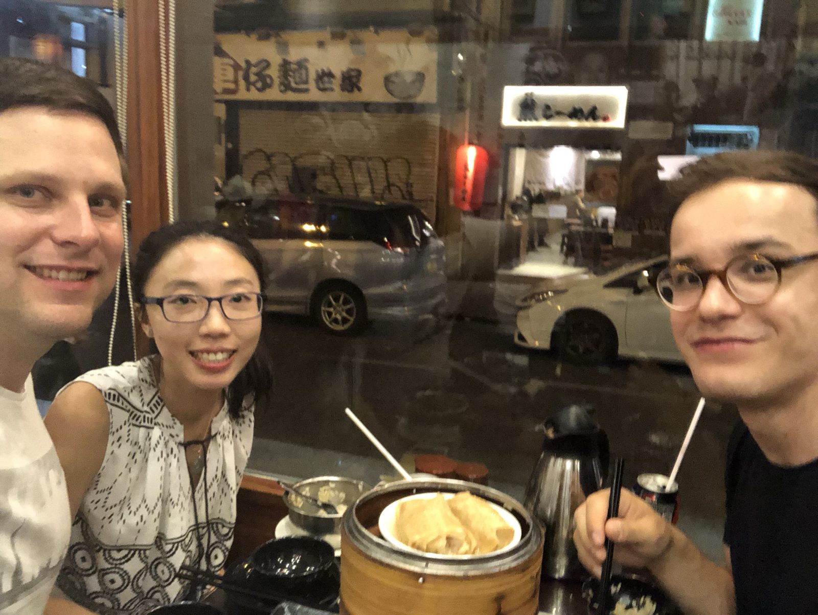 Late-night dumplings shared with a friend at a Hong Kong noodle house