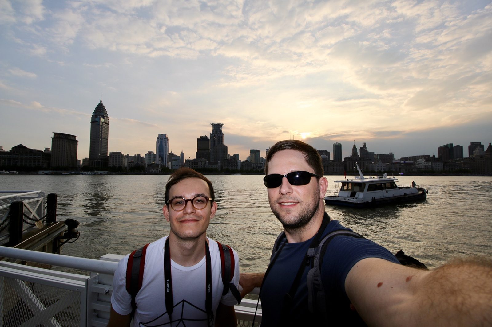 Donat and me on the Huangpu waterfront at sunset, the Bund skyline behind us